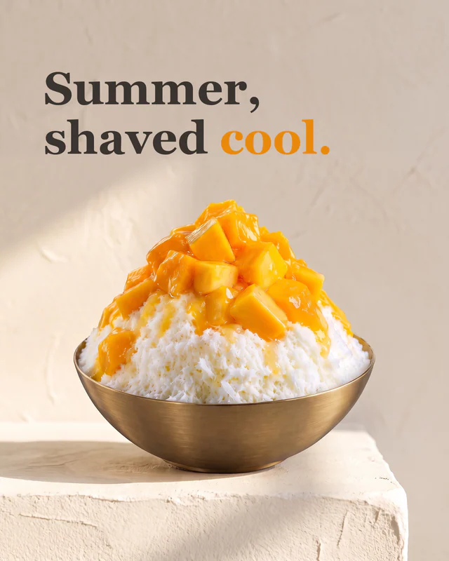 Mango bingsu in a brass bowl on a sunlit plaster plinth, headline "Summer, shaved cool."